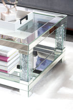 Berni 47.2" Glam Mirror & Glass Top Coffee Table with Shelf - Silver Metal with Diamond Look Legs|Table à café somptueuse Berni de 47,2 po avec dessus en miroir et en verre et tablette - métal argenté avec pattes à apparence de diamant