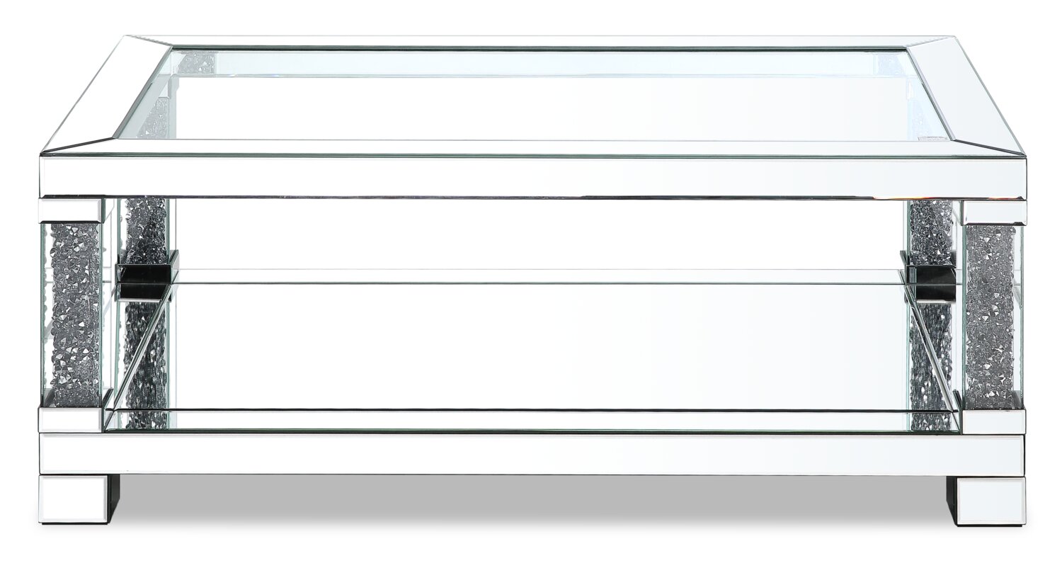 Berni 47.2" Glam Mirror & Glass Top Coffee Table with Shelf - Silver Metal with Diamond Look Legs|Table à café somptueuse Berni de 47,2 po avec dessus en miroir et en verre et tablette - métal argenté avec pattes à apparence de diamant